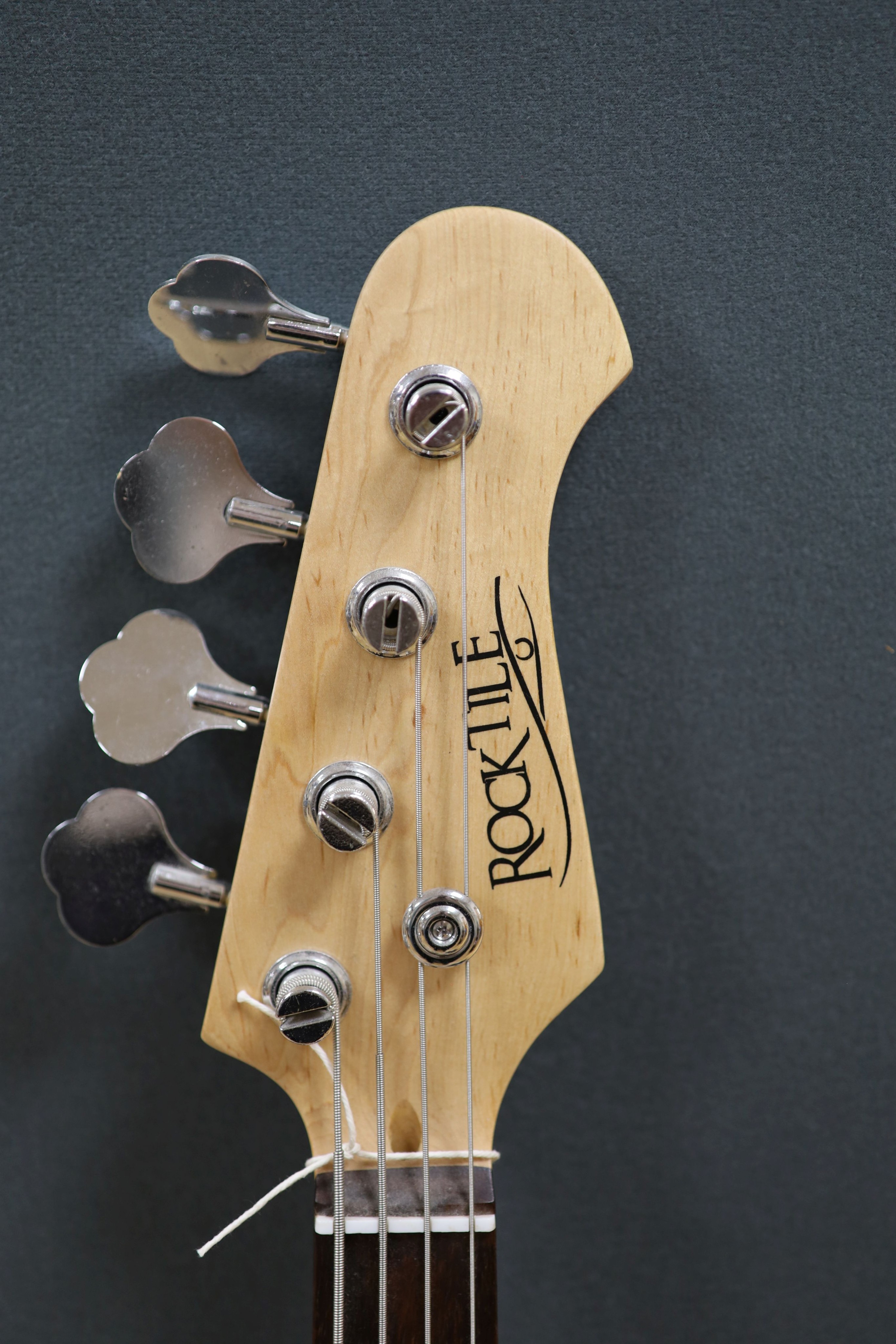 A Rock tile electric base guitar and a Great amplifier